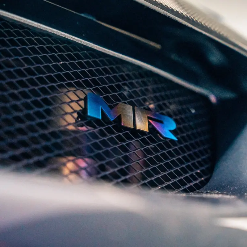 Jdc Titanium "Mr" Front Grill Badge | Mitsubishi Evo 8/9 11