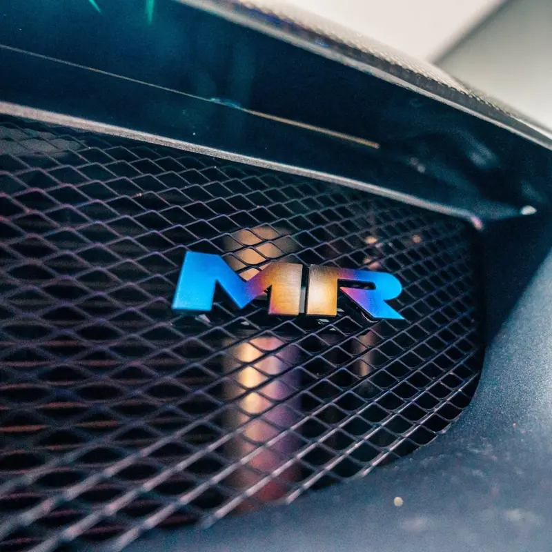 Jdc Titanium "Mr" Front Grill Badge | Mitsubishi Evo 8/9 12