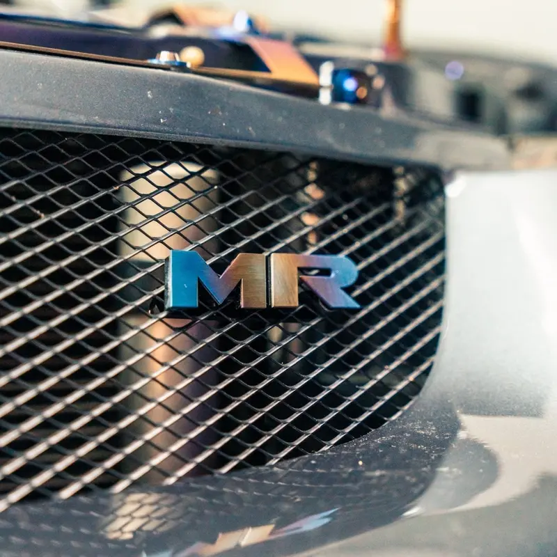Jdc Titanium "Mr" Front Grill Badge | Mitsubishi Evo 8/9 6