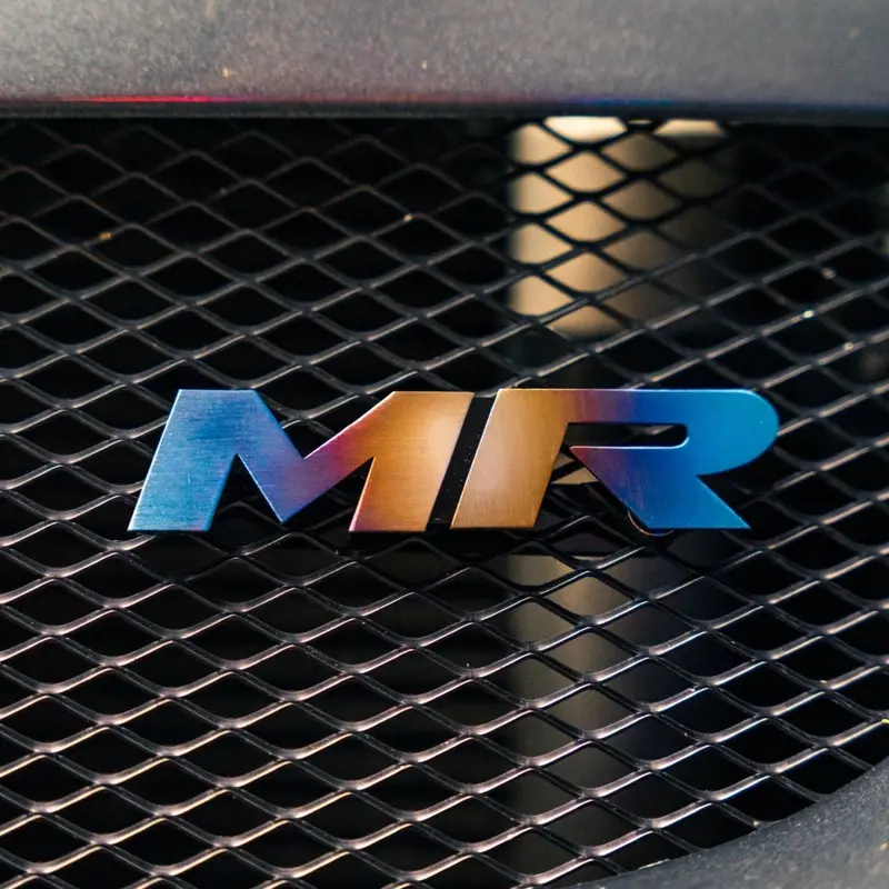 Jdc Titanium "Mr" Front Grill Badge | Mitsubishi Evo 8/9 7