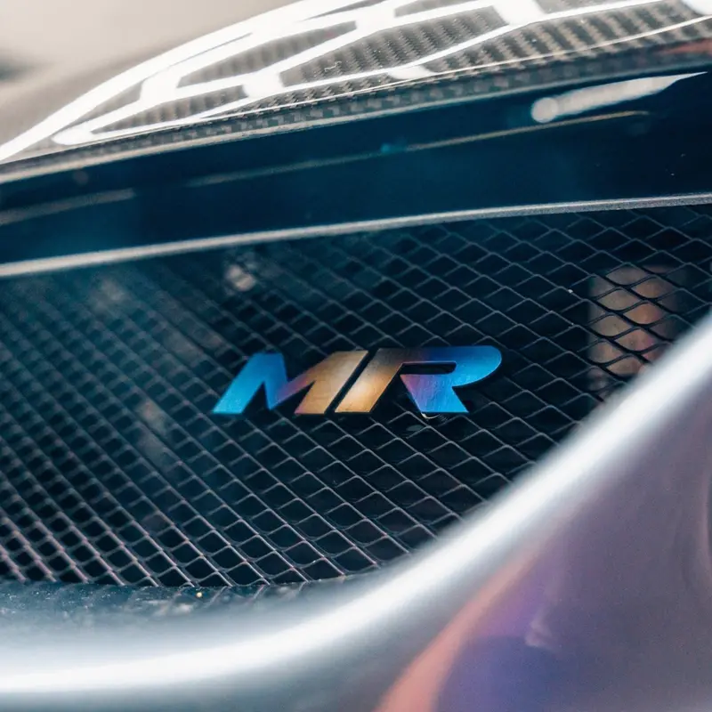 Jdc Titanium "Mr" Front Grill Badge | Mitsubishi Evo 8/9 9
